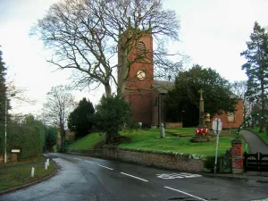 Goostrey church, view looking north stading above a road that is running along the church to the left